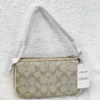 Bolsa De Mano Coach Signature Canvas Color Beige